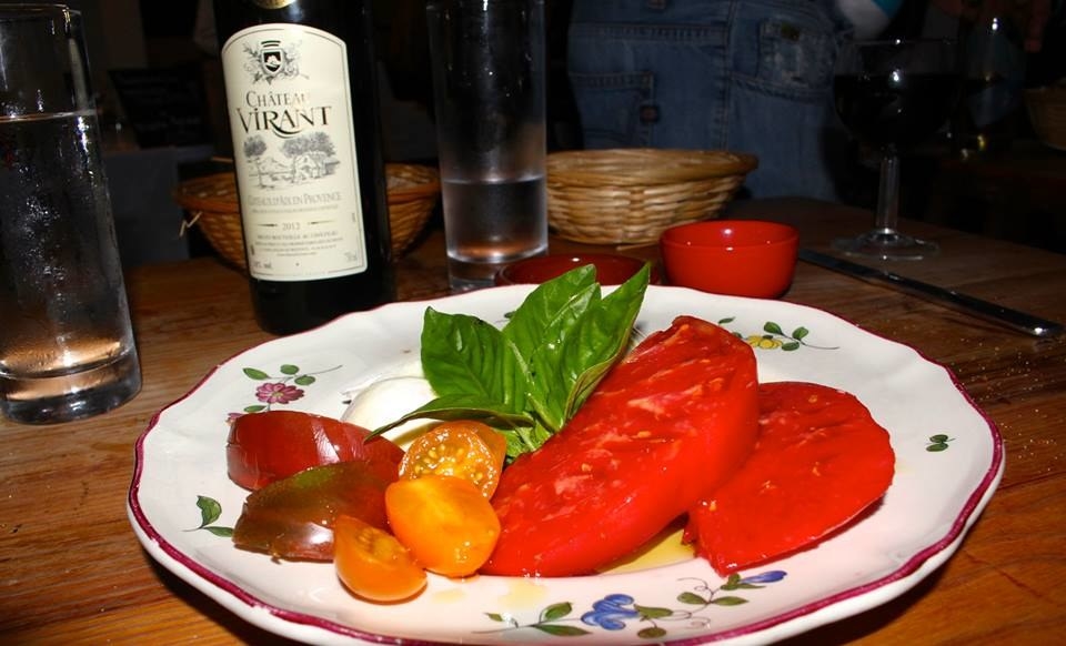 A plate of tomatoes and basil in Nice, France.