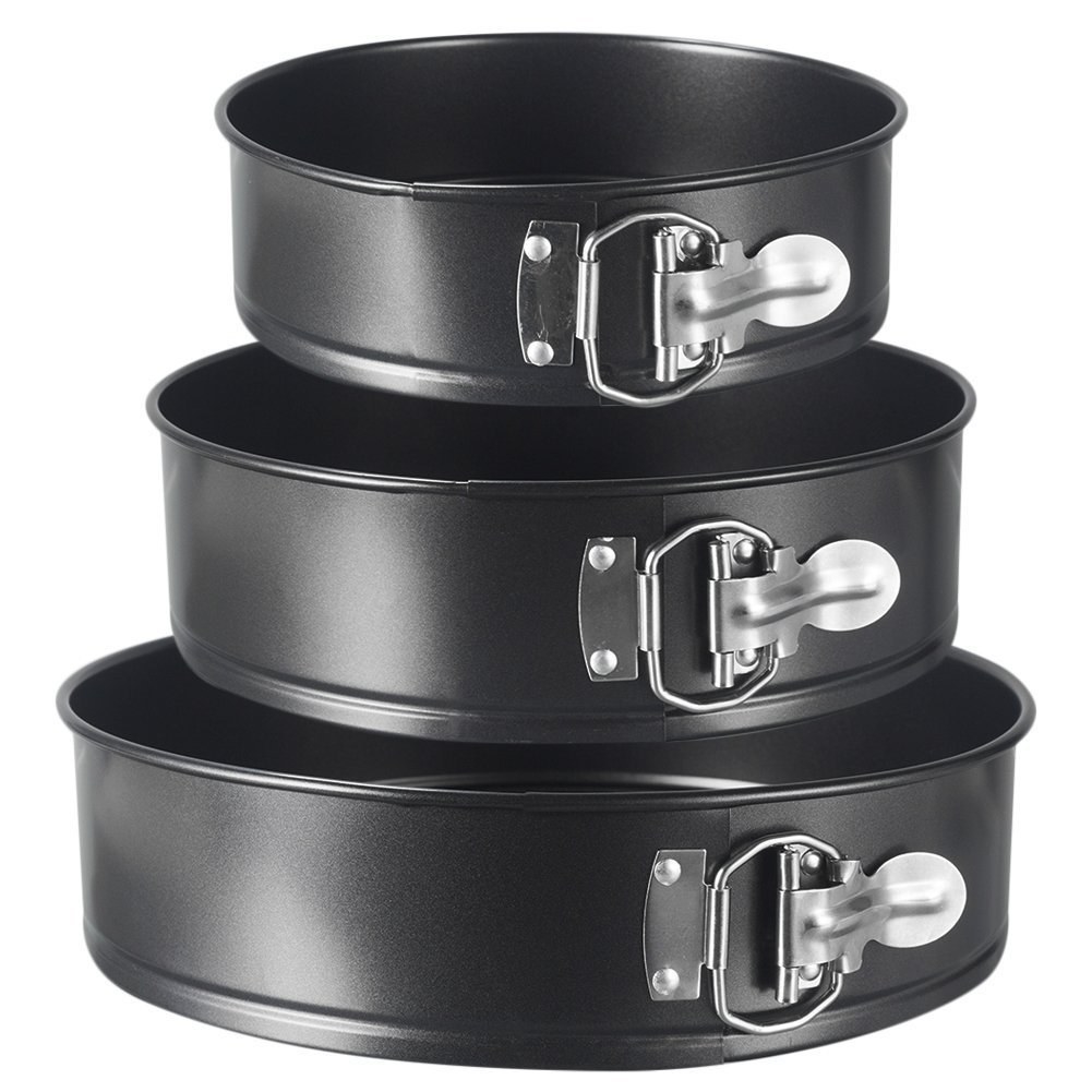 A set of three round metal baking pans stacked on top of each other