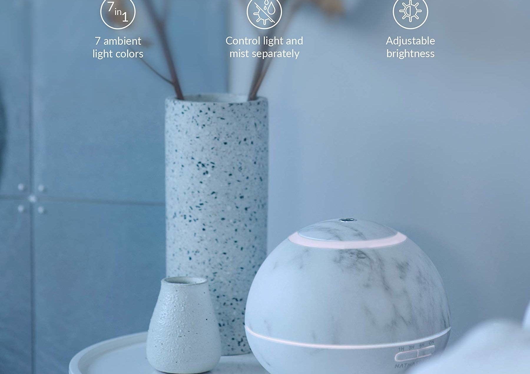 The Hathaspace Marble Essential Oil Aroma Diffuser in a bedroom