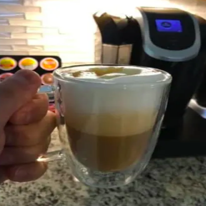 Reviewer's cup of frothy coffee 