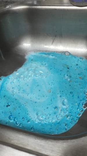 The blue sudsy disposal cleaner in a reviewer's sink 