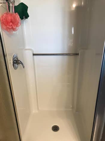 Same reviewer's shower looking completely white and clean 