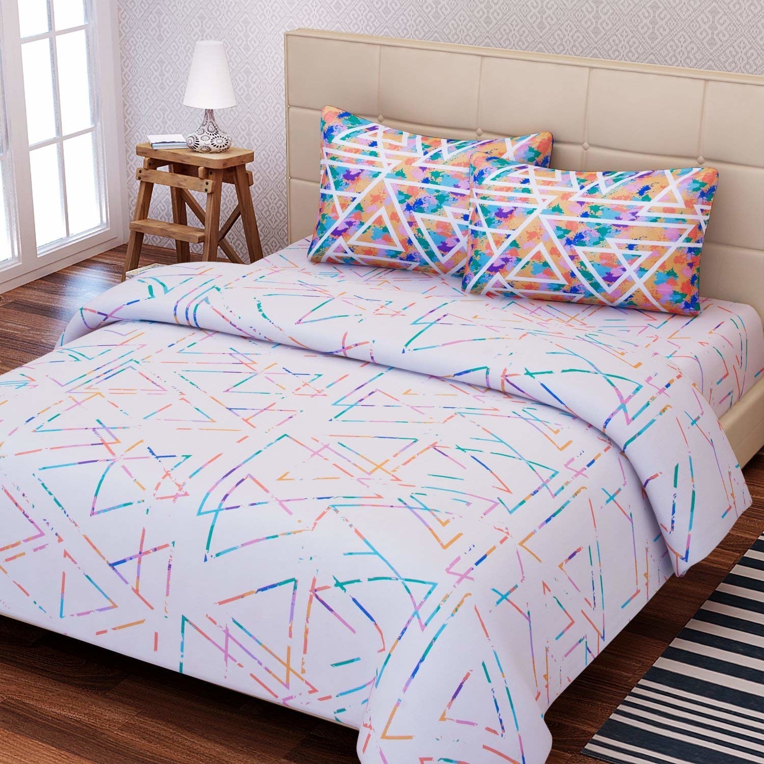A geometric bedsheet on a bed