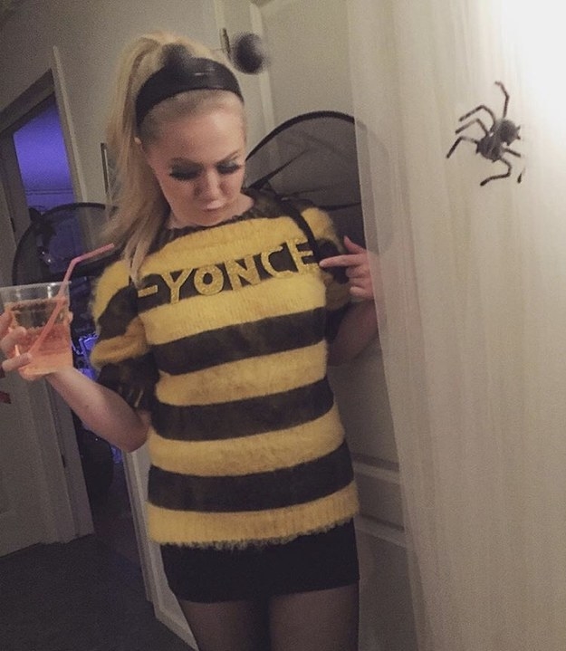 A woman dressed as a bee with &quot;-yonce&quot; on the shirt