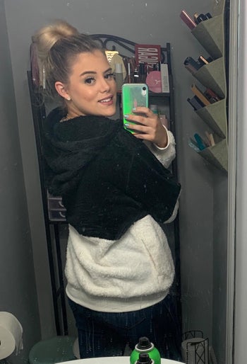 reviewer shows off back of fleece 