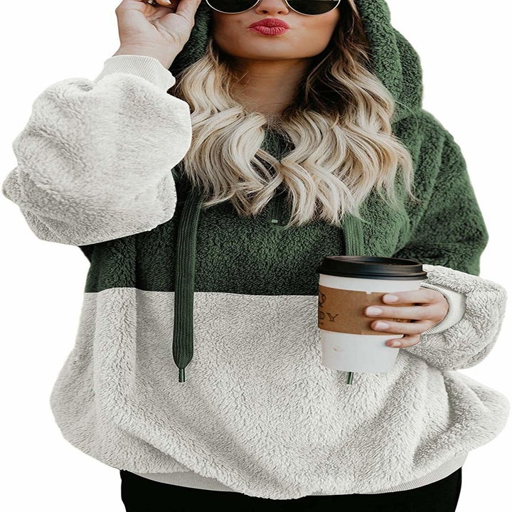 model wears two toned fleece with hood