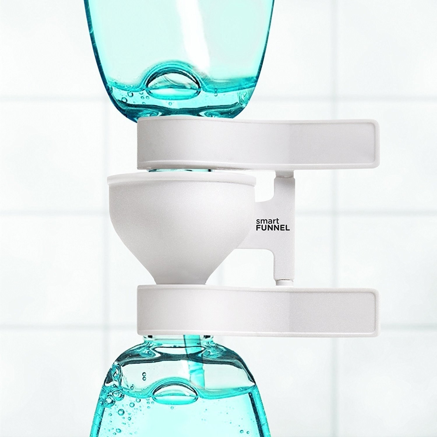 the funnel, which clips to two bottles, allowing one bottle of product to drain into a bottom one