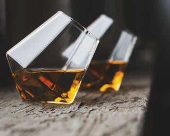 The diamond-shaped tumblers filled with whiskey