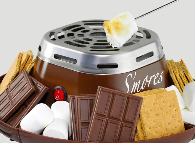 Small heater with bowl sides to fill with chocolate, marshmallows, and crackers 