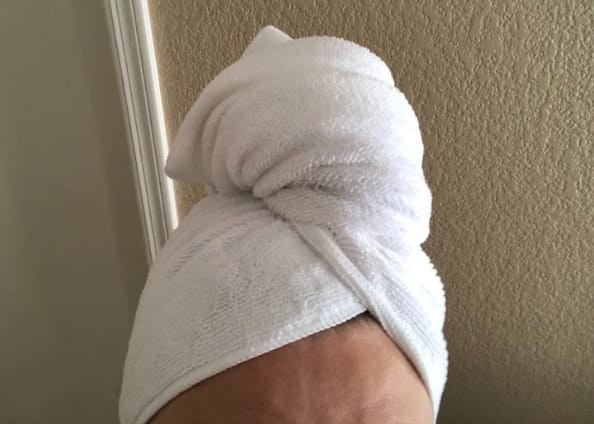 A reviewer&#x27;s hair wrapped up in a microfiber towel 