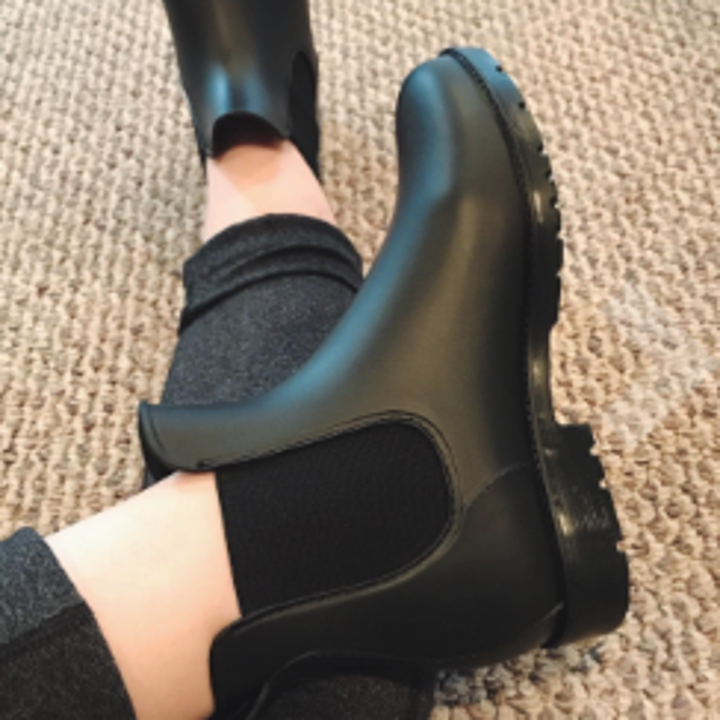 a reviewer wearing the chelsea boot rainboots