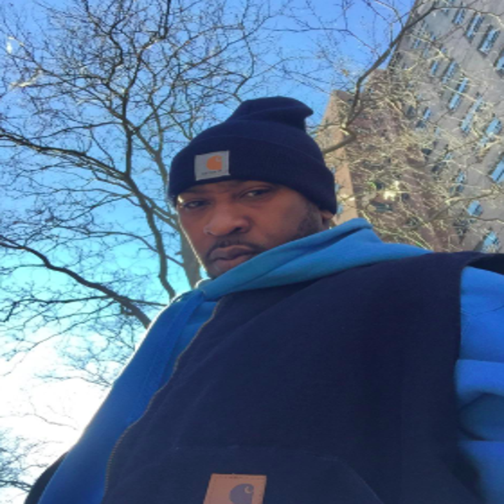 reviewer pic of person wearing Carhartt navy cap with a matching coat