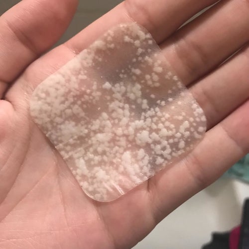 Reviewer's square acne patch that is filled with pimple discharge
