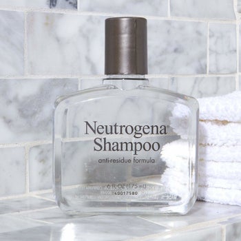The clear bottle of shampoo 