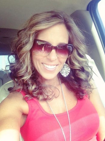 Reviewer showing their bouncy, curled hair 