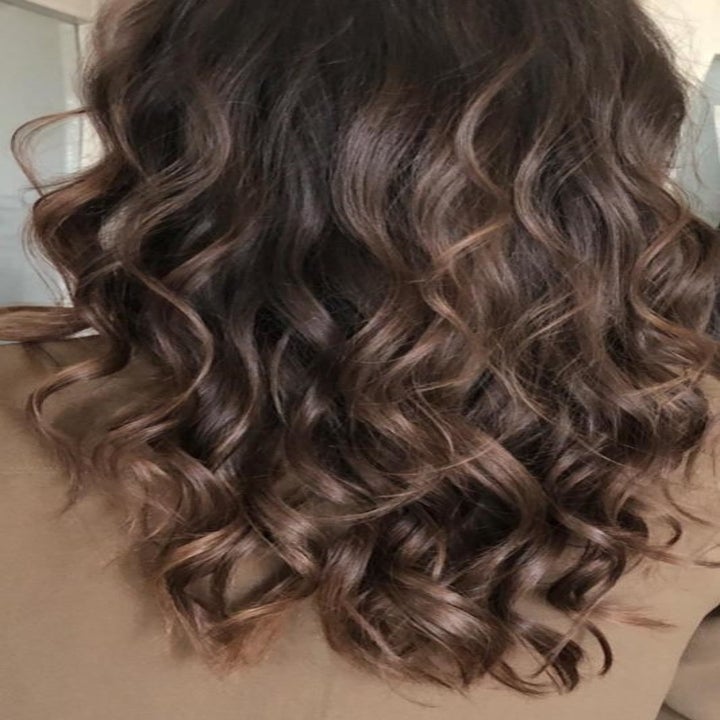 reviewer's brown tousled curls 