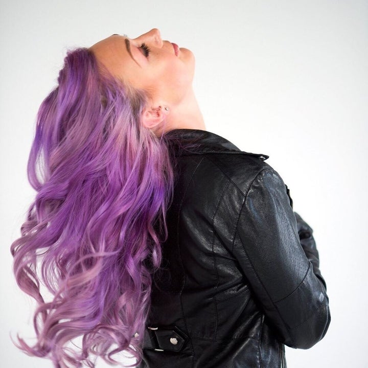 model with purple wavy hair 