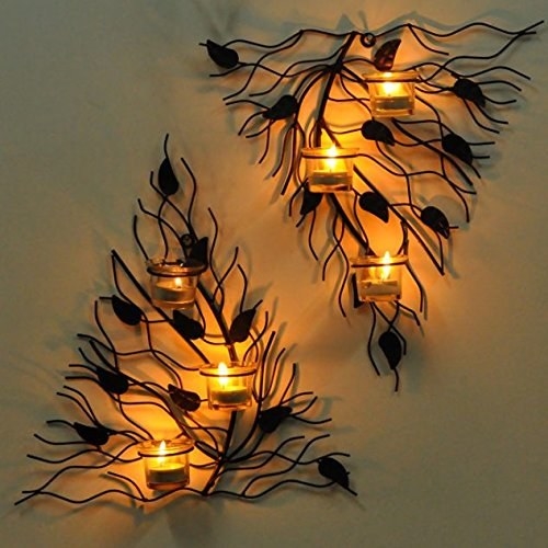 Wall sconces lit up while hanging on a wall.