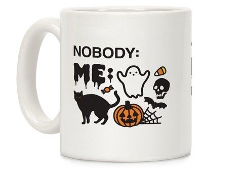 A white mug that references a meme and says, &quot;nobody:&quot; and the line is blank and then says, &quot;me:&quot; next to spooky-themed emojis