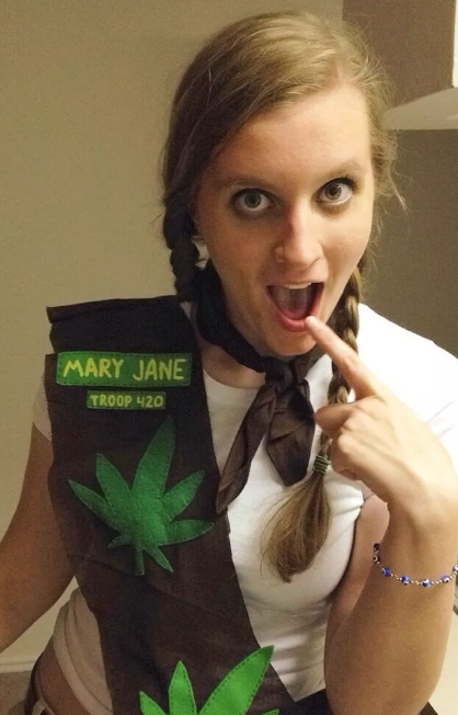 girl dressed as a brownie scout that has weed