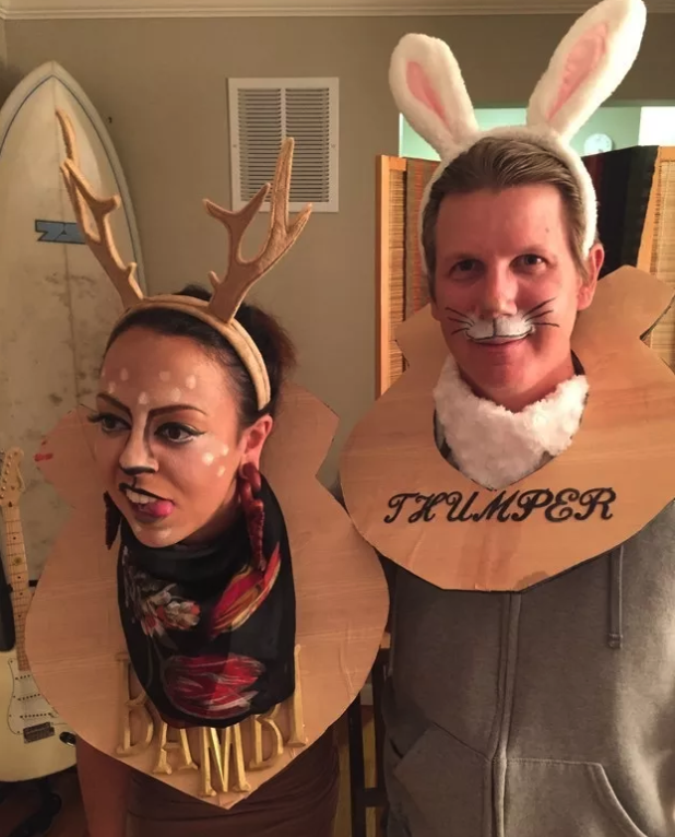 people dressed as animals with their heads mounted on the wall