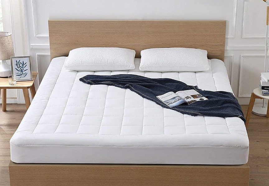 The mattress topper on a queen bed