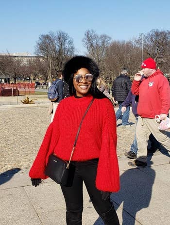 Reviewer wearing the sweater in bright red