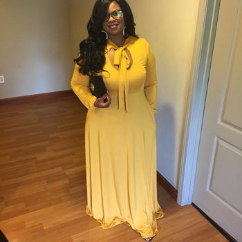 Reviewer wearing the long-sleeved dress in yellow
