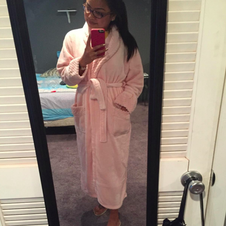reviewer in a pink robe