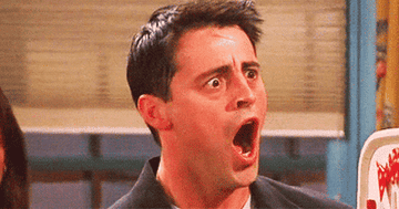 GIF of Joey from Friends looking shocked with his mouth wide open 