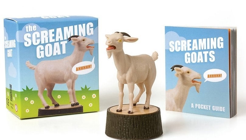 The goat figurine, plus the box it comes in and the booklet