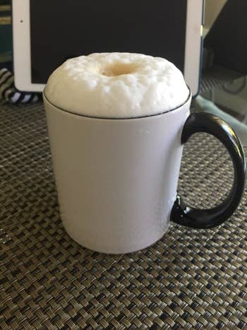 A java cupful with frothed beverage astatine the top