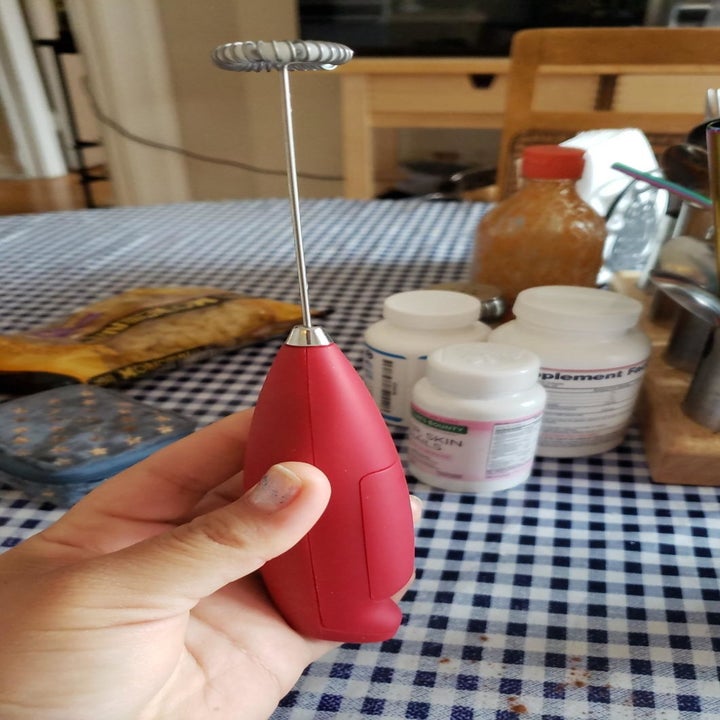 The milk frother in red