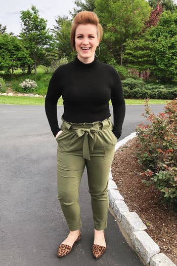 reviewer wearing the pants in dark green 
