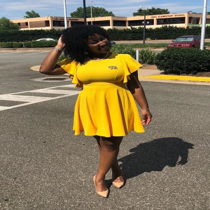 reviewer wearing the dress in yellow 