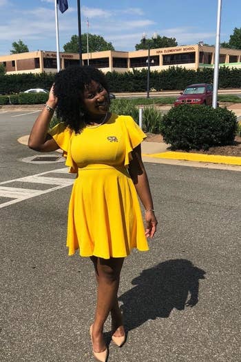 reviewer wearing the dress in yellow 