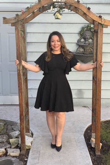 reviewer wearing the dress in black 