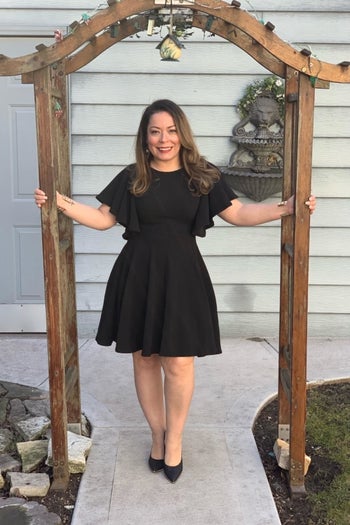 reviewer wearing the dress in black 