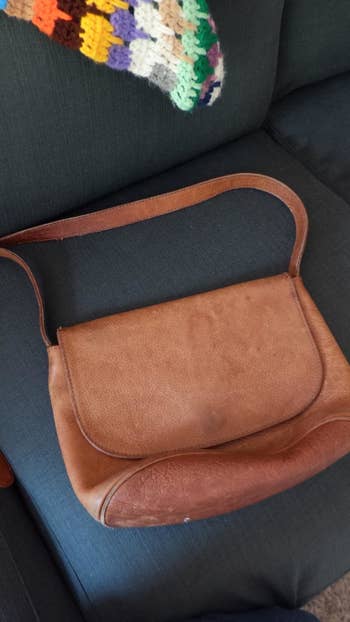 Reviewer photo of scuffed handbag