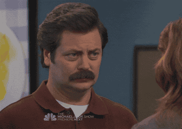 Nick Offerman as Ron Swanson in &quot;Parks and Recreation&quot; slowing grinning