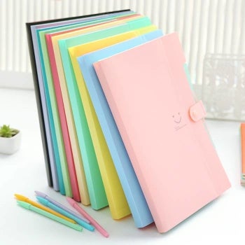 the pastel folders with a snap closure in pink, blue, yellow, green, and more 
