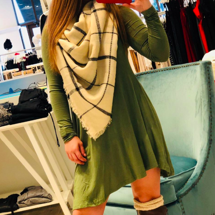 A customer review photo of the dress in green