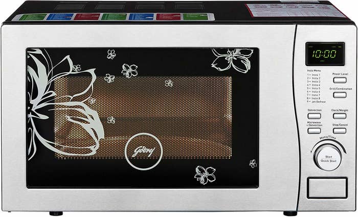 A Godrej Convection Microwave Oven in silver and black.