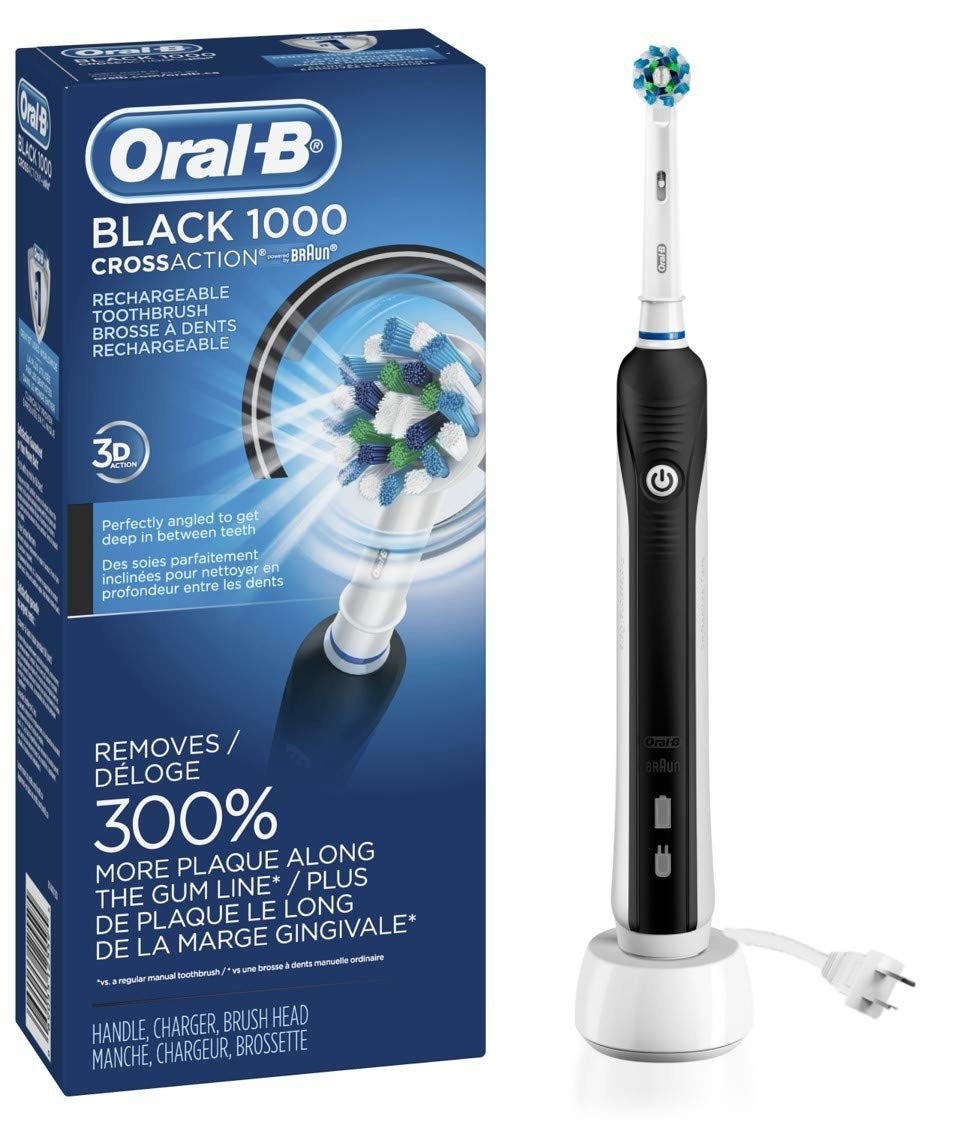 An electric toothbrush placed on a round base