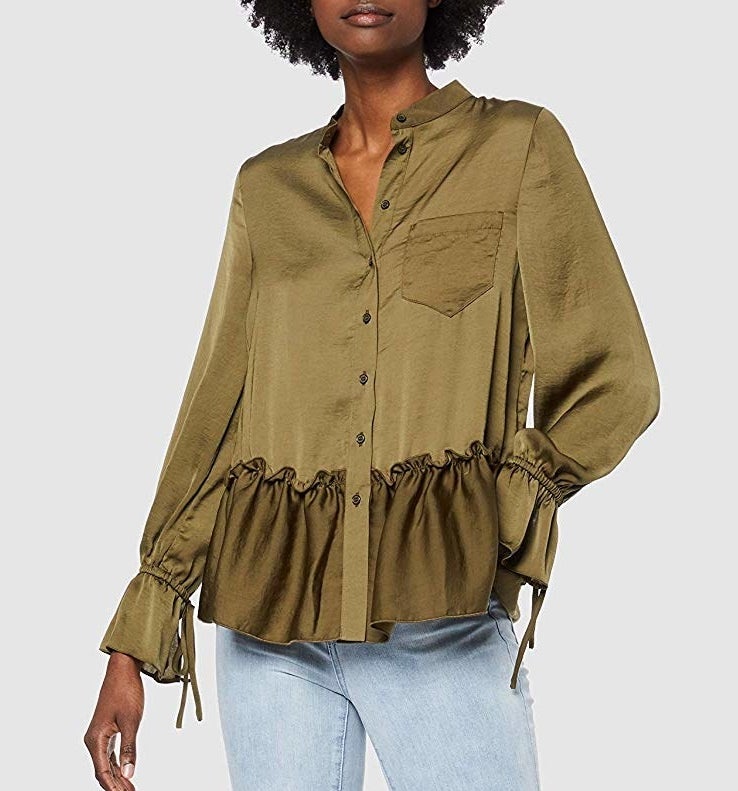 model wearing satin olive green sleeved top