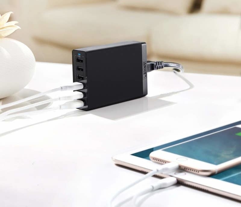 rectangle-shaped charging port with spaces for six usbs to be plugged into the front