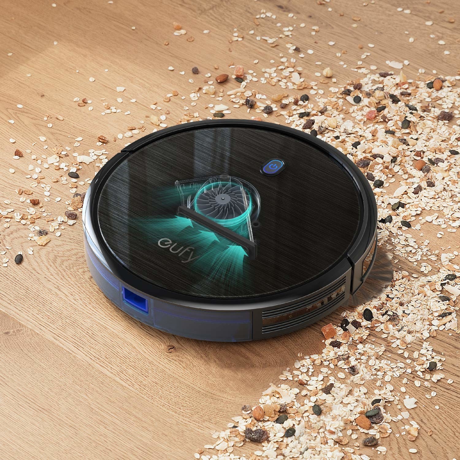 The vacuum picking up oats and raisins off a hardwood floor