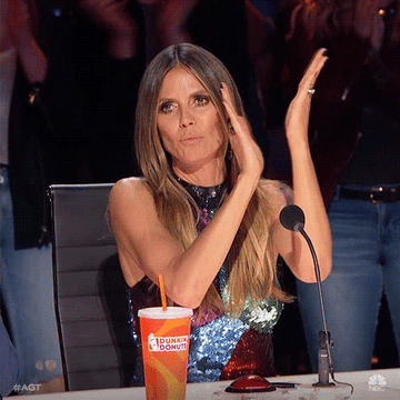GIF of Heidi Klum clapping and saying &quot;wow&quot; 