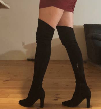 straight-size reviewer wearing the black thigh-high boots