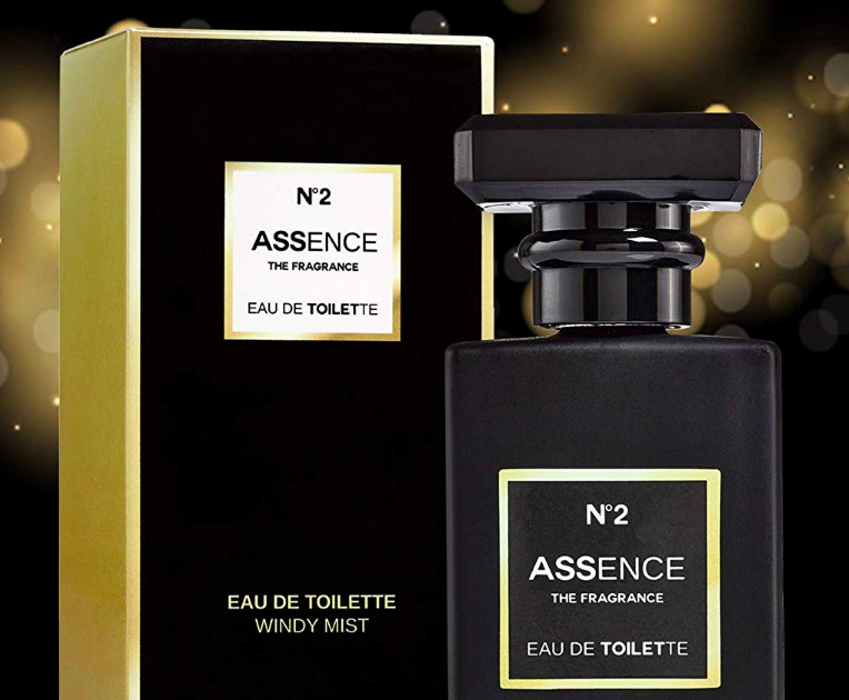 Fancy looking bottle of perfume beside packaging